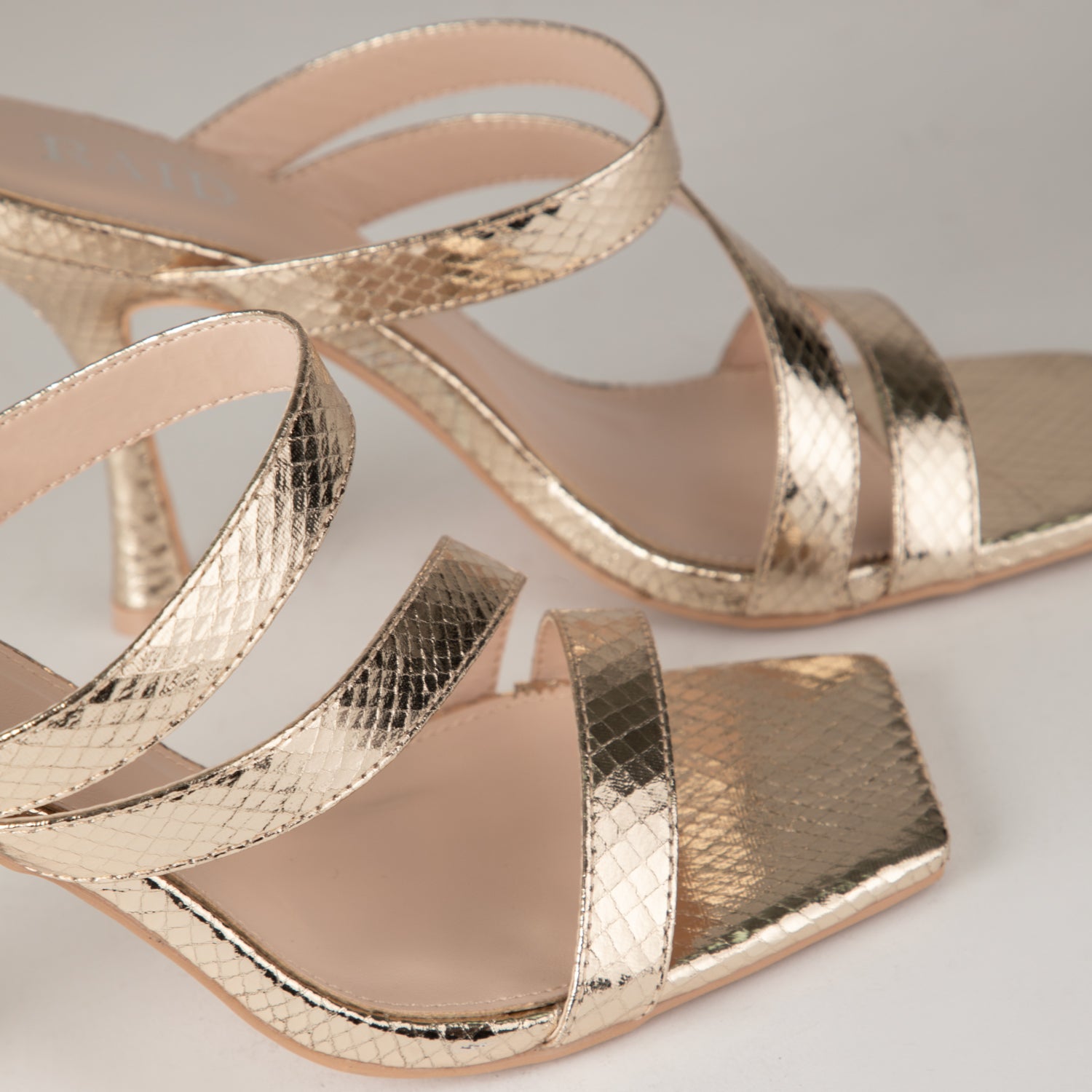 RAID Baylin Heeled Mules in Gold Snake