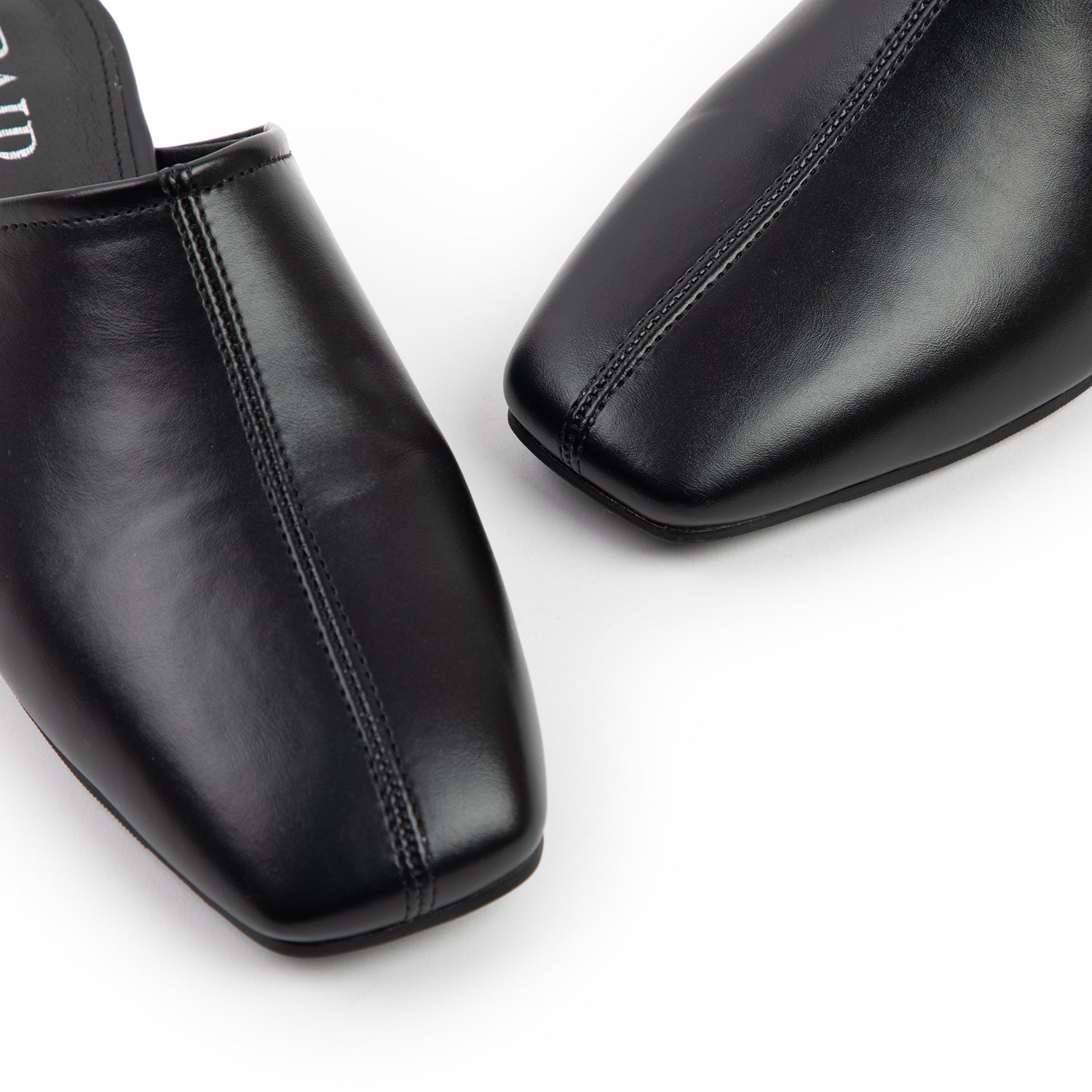 RAID Delta Slip On Mules in Black