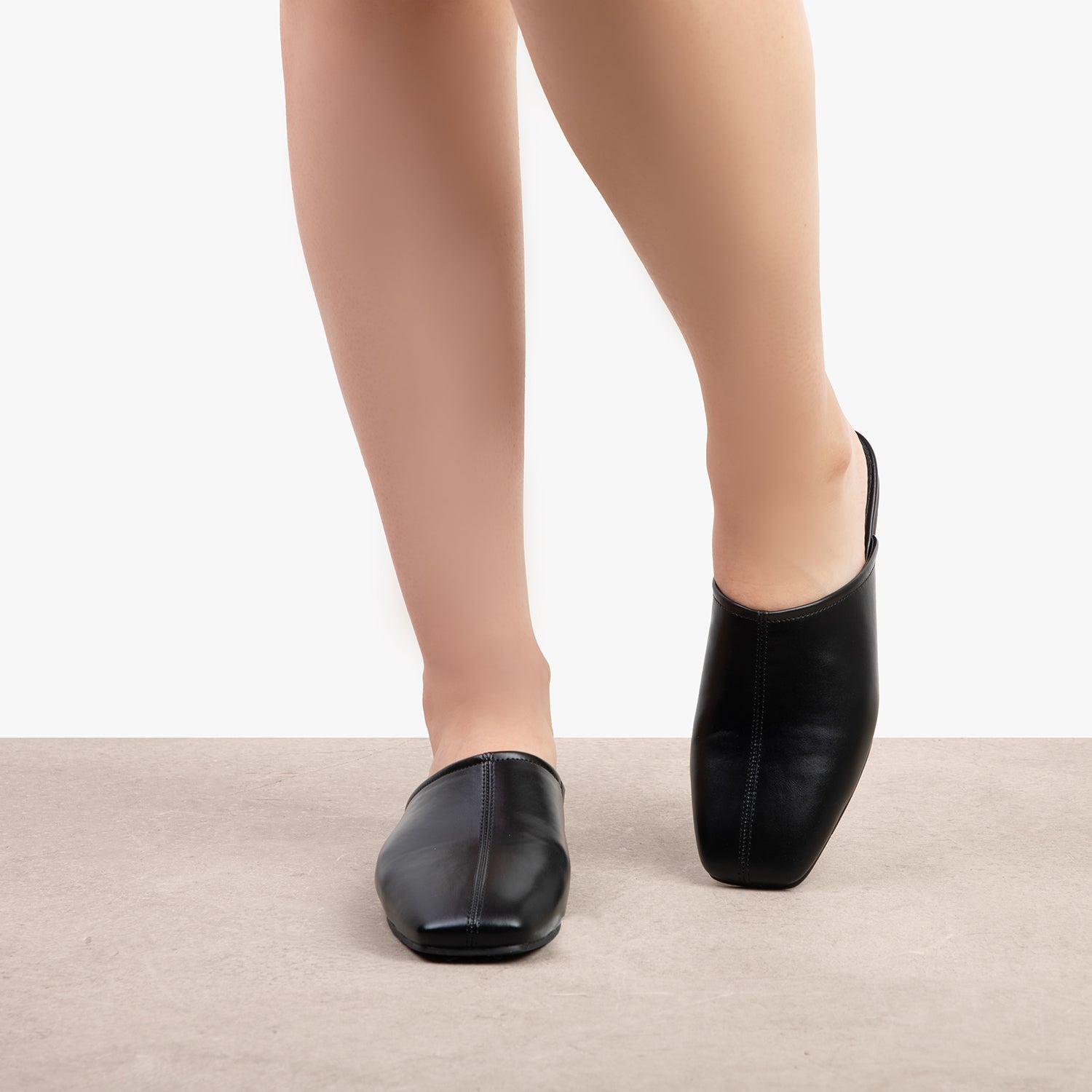 RAID Delta Slip On Mules in Black